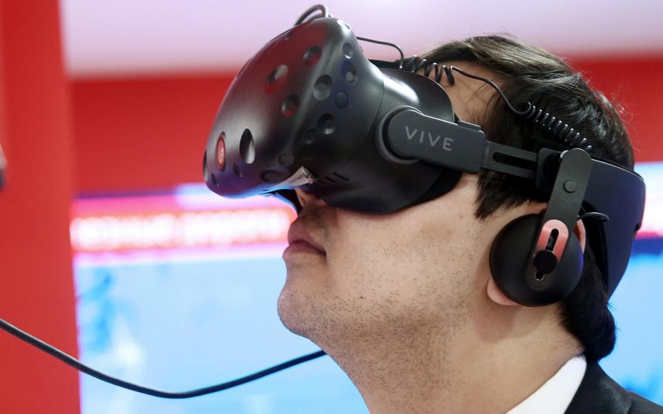 Headsets such as HTC's Vive have struggled to attract sales - TASS