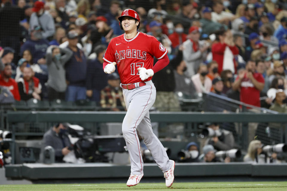 SEATTLE, WASHINGTON - OCTOBER 02: Shohei Ohtani #17 of the Los Angeles Angels scores on a three-run home run by Jared Walsh #20 during the eighth inning against the Seattle Mariners at T-Mobile Park on October 02, 2021 in Seattle, Washington. (Photo by Steph Chambers/Getty Images)