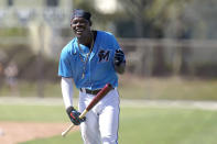 FILE - Miami Marlins' Jazz Chisholm laughs during spring training baseball practice in Jupiter, Fla., in this Friday, Feb. 26, 2021, file photo. For the Jeter regime, instant success hasn't happened at all. Four of the Marlins' top 12 prospects made their MLB debuts last year, and none batted above .170.(AP Photo/Jeff Roberson)