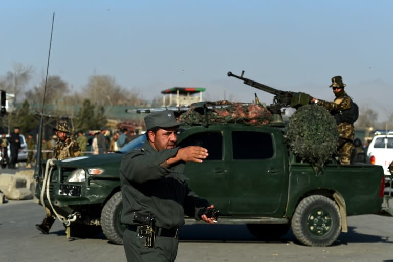 Afghan security personnel arrive at the scene following a Taliban suicide bombing near the gate of Ministry of Defence in Kabul on February 27, 2016