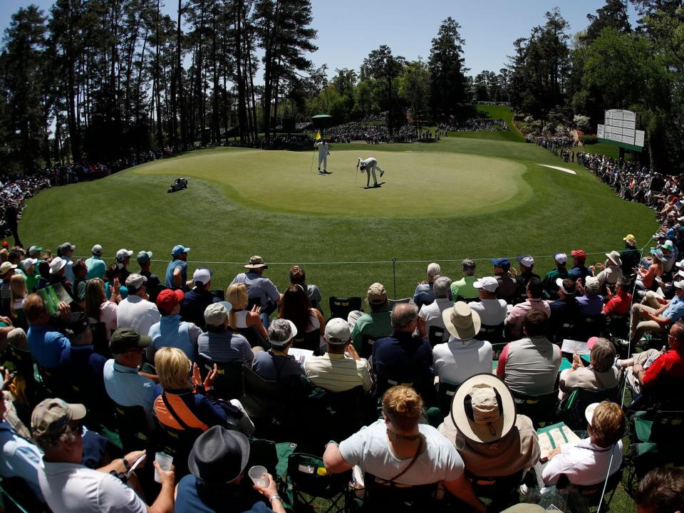 Bubba Watson putts on the sixth hole during the first round at the Masters golf tournament in Augusta, Ga.
