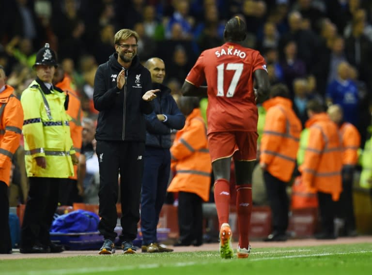 Liverpool's Mamadou Sakho (R) claimed in a Snapchat post the club were telling "lies" about his fitness leading to a private chat with manager Jurgen Klopp (L)