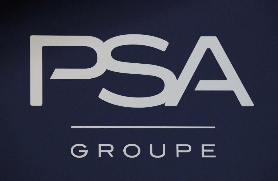 FILE - In this Thursday, Feb. 23, 2017, file photo, the logo of PSA Group is pictured in Paris. Italian-American carmaker Fiat Chrysler Automobiles on Wednesday OCT.30, 2019 confirmed that it is in talks with French rival PSA Peugeot, its second bid this year to reshape the global auto industry facing huge challenges with the transition to electric and autonomous vehicles. (AP Photo/Christophe Ena, File)