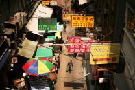 Shoppers walking in a Hong Kong street.