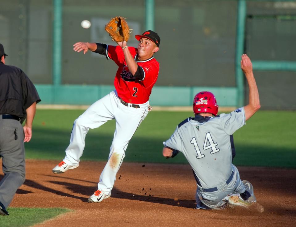 Pacific's Miles Haddad, left, reaches for the throw from the catcher as Fresno State's McCarthy Tatum slides safely on a successful steal of second during a baseball game at Pacific's Klein Family Field in Stockton, June 10, 2016.