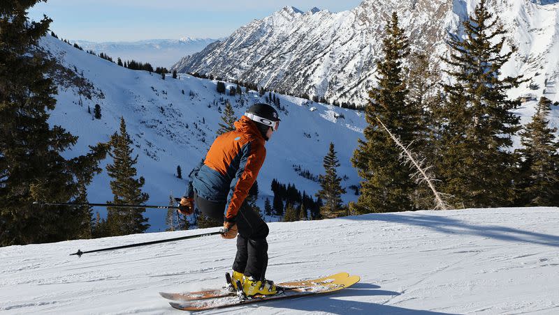 A skier has a view of Little Cottonwood Canyon at Alta Ski Resort on Friday, Dec. 15, 2023. Many Utah resorts are still waiting to open all their terrain.