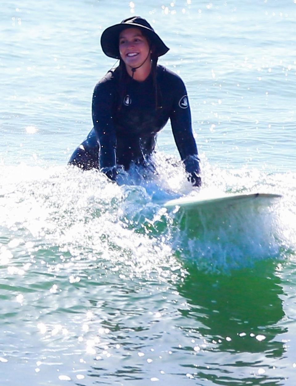 <p>Leighton Meester goes surfing in Malibu on Thursday with Adam Brody. </p>
