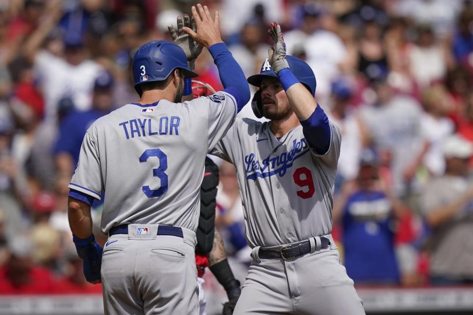 The Dodgers' Gavin Lux celebrates with teammate Chris Taylor.