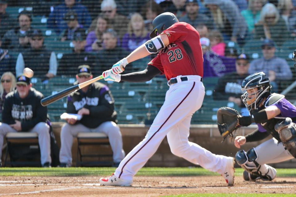 Feb 23, 2019; Salt River Pima-Maricopa, AZ, USA; Arizona Diamondbacks right fielder Steven Souza Jr. (28) hits a 3 run home run during the first inning against the Colorado Rockies at Salt River Fields at Talking Stick. Mandatory Credit: Matt Kartozian-USA TODAY Sports