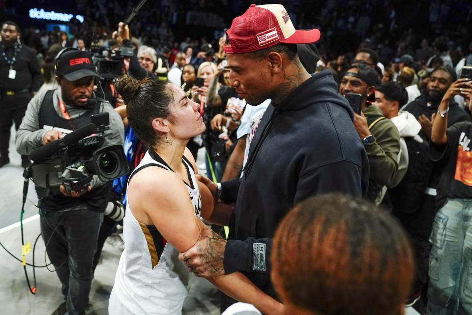 Las Vegas Aces' Kelsey Plum, left, talks with New York Giants Darren Waller after Game 4 of a WNBA basketball final playoff series against the New York Liberty Wednesday, Oct. 18, 2023, in New York. The Aces won 70-69. (AP Photo/Frank Franklin II)