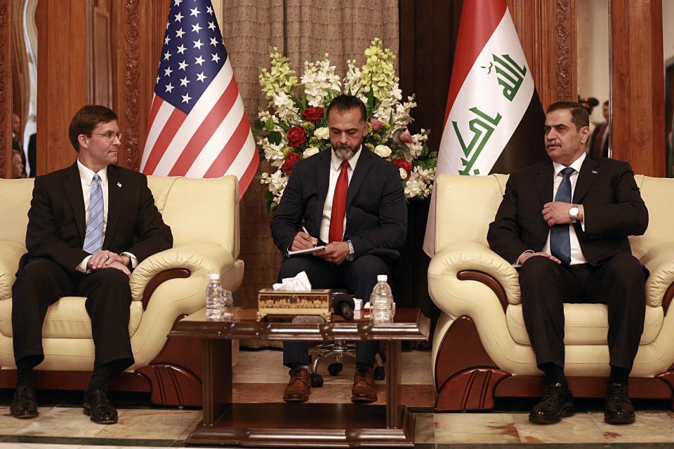 Iraqi Defense Minister Najah al-Shammari, right, meets with visiting U.S. Defense Secretary Mark Esper, left, at the Ministry of Defense in Baghdad, Iraq, Wednesday, Oct. 23, 2019. Esper has arrived in Baghdad on a visit aimed at working out details about the future of American troops that are withdrawing from Syria to neighboring Iraq. (AP Photo/Hadi Mizban)