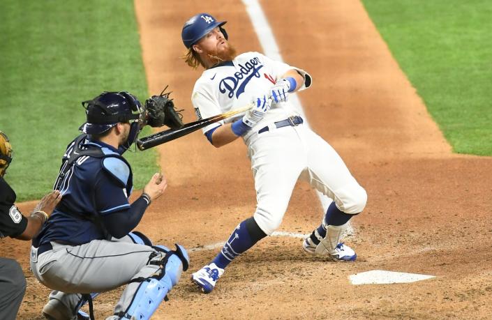 Justin Turner avoids a pitch in front of Rays catcher Mike Zunino