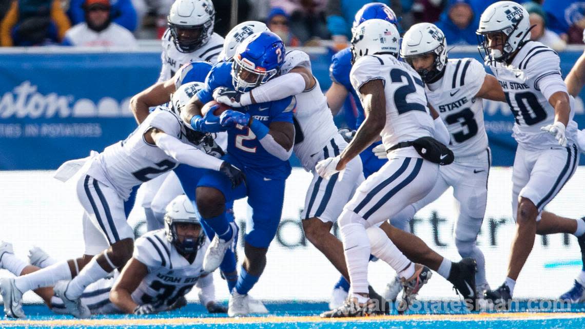 Boise State running back Ashton Jeanty picks up a crowd of Aggies in the Broncos’ final regular season game against Utah State, Friday, Nov. 25, 2022, at Albertsons Stadium in Boise.