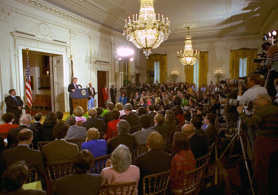 FILE - In this March 23, 1993, file photo, members of the media fill the East Room of the White House during President Bill Clinton's first formal news conference since taking office. (AP Photo/Marcy Nighswander, File)