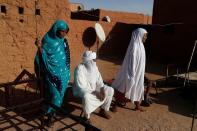 Silymane Hiyan Hiyar, 53, an ex-rebel and leading member of the peace committee, sits at his home's courtyard in Agadez