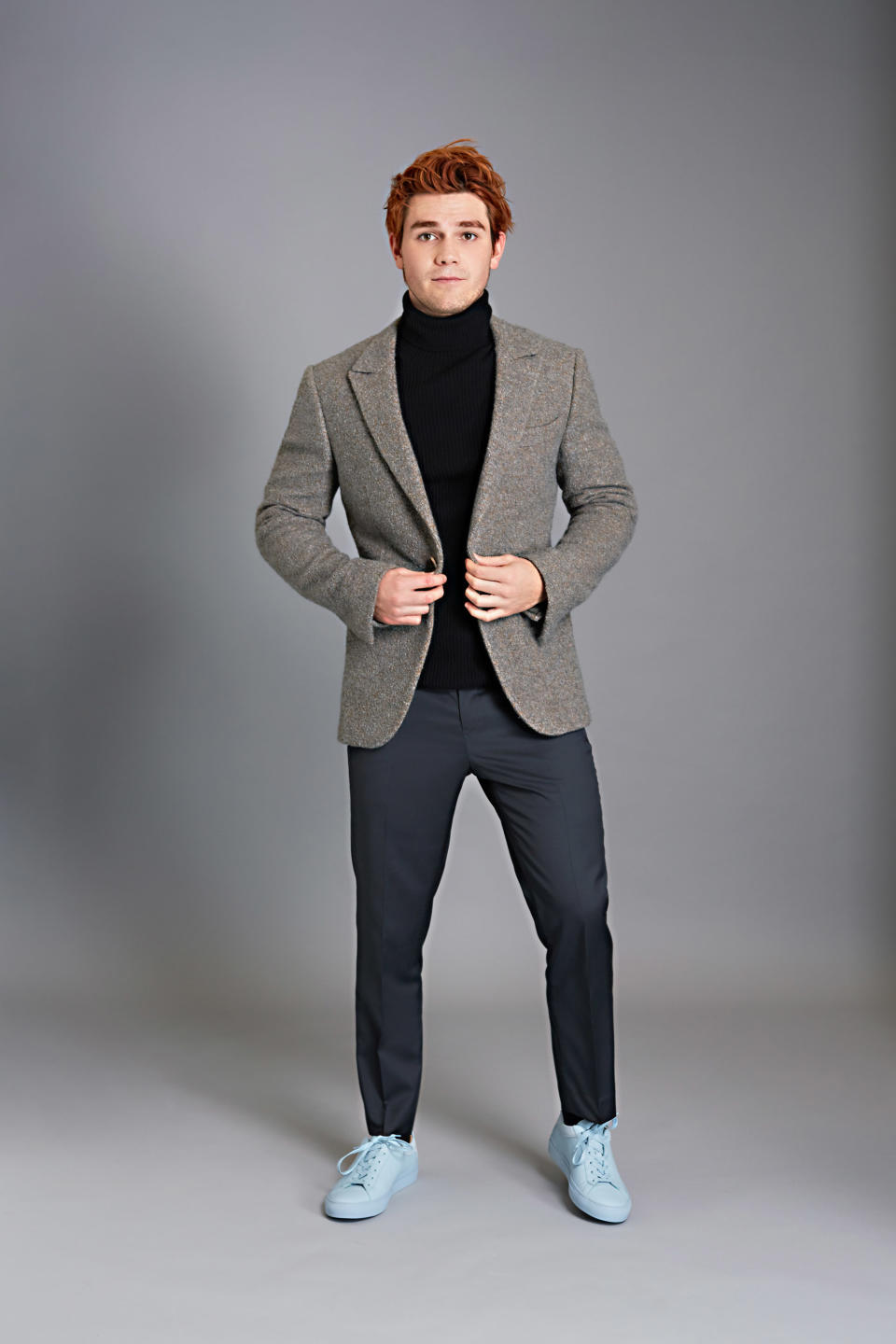 <p>Suit jacket by Ermenegildo Zegna Couture, turtleneck sweater by Theory, trousers by Tommy Hilfiger, sneakers by Koio.</p>
