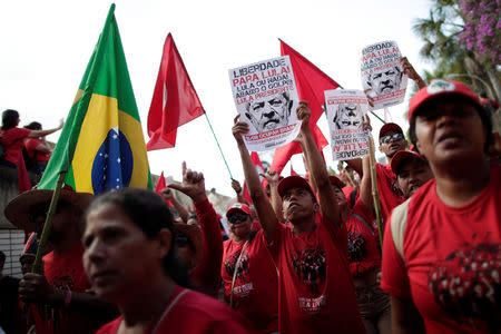 Supporters of imprisoned former Brazil's President Luis Inacio Lula da Silva attend a march before his Workers' Party (PT) officially registers his presidential candidacy, in Brasilia, Brazil, August 15, 2018. REUTERS/Ueslei Marcelino