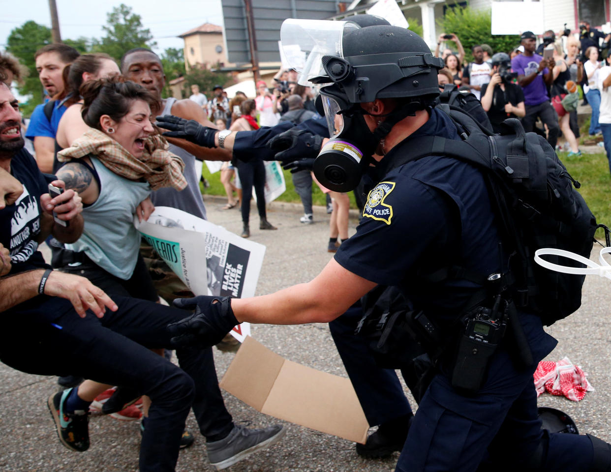 Demonstrators scuffle with police during protests in Baton Rouge, Louisiana, U.S., July 10, 2016.  REUTERS/Shannon Stapleton