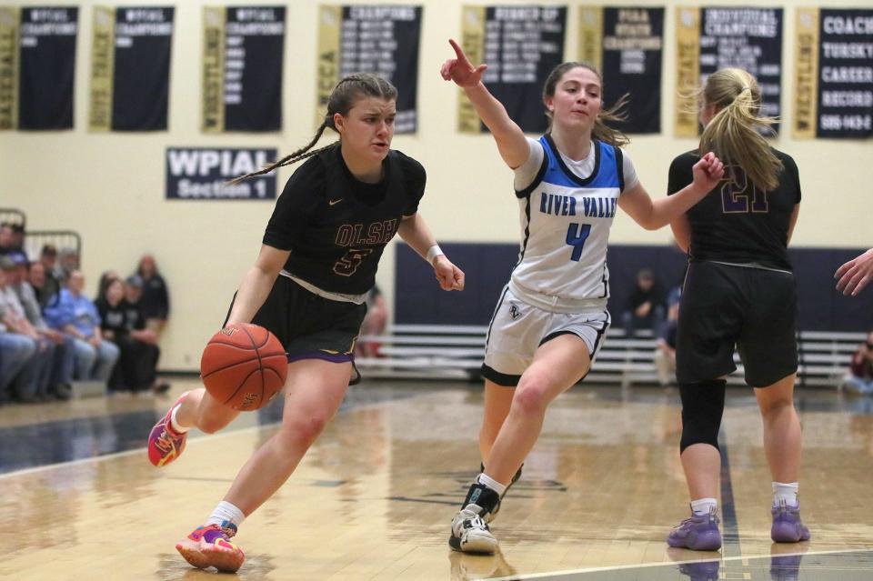 OLSH's Kyleigh Nagy (5) drives around River Valley's Ava Persichetti (4) during the first half of the PIAA 3A Semifinals game Monday night at Kiski Area High School in Leechburg, PA.