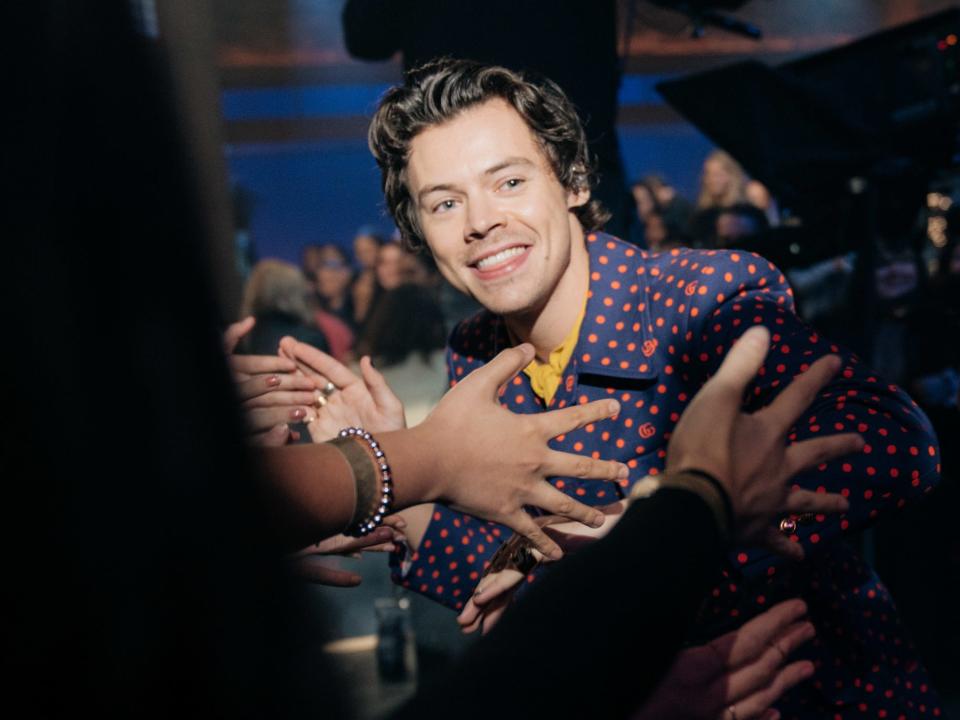 Harry Styles poses for photos during an appearance on The Late Late Show