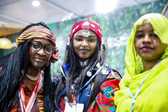 Women in traditional dresses pose in Congo Pavilion on the second day of the COP27 UN Climate Change Conference, held by UNFCCC in Sharm El-Sheikh International Convention Center. COP27, running from November 6 to November 18 in Sharm El Sheikh focuses on implementation of measures already agreed during previous COPs. The Conference in Sharm El Sheikh focuses also on the most vulnerable communities as the climate crisis hardens life conditions of those already most disadvantaged.