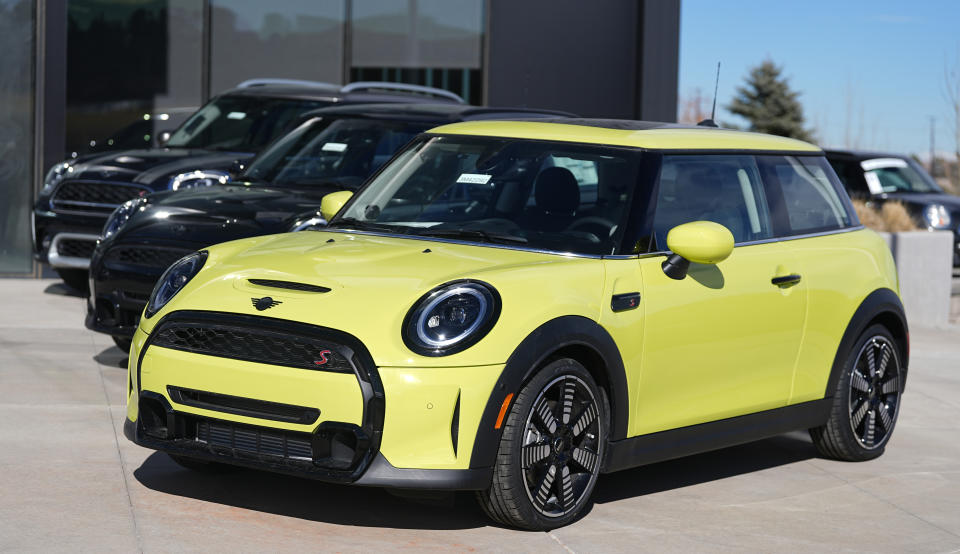 A line of unsold 2024 Cooper S hardtops sits on display at a Mini dealership Monday, Jan. 29, 2024, in Highlands Ranch, Colo. From Wall Street investors to car dealers to potential home buyers, many Americans are eager for the Federal Reserve to start cutting its benchmark interest rate and reducing borrowing costs throughout the economy. (AP Photo/David Zalubowski)