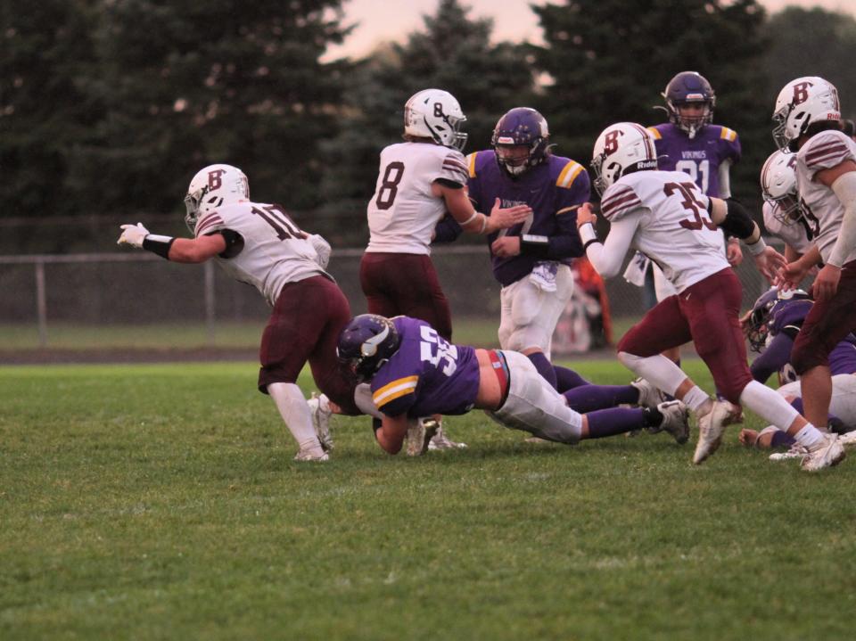 Conner Harvey makes a diving tackle for Bronson on Thursday.