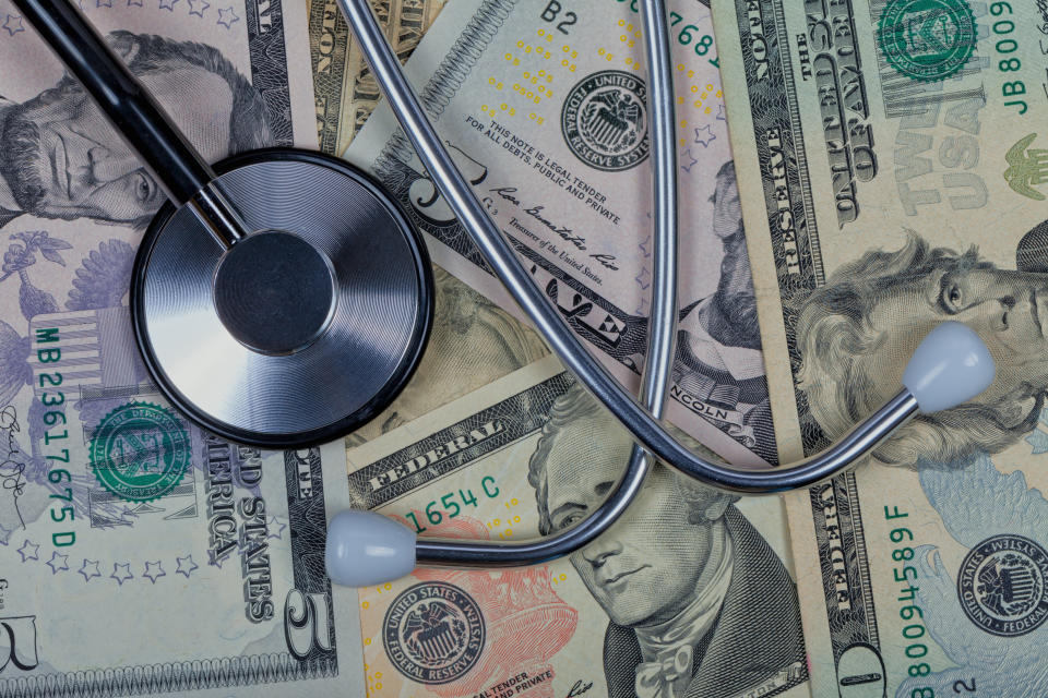 A stethoscope on top of American dollar bills. Photo: Getty