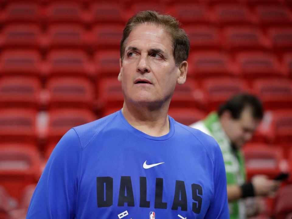 Dallas Mavericks owner Mark Cuban watches players warm up before the start of an NBA basketball game against the Miami Heat, Friday, Feb. 28, 2020, in Miami.