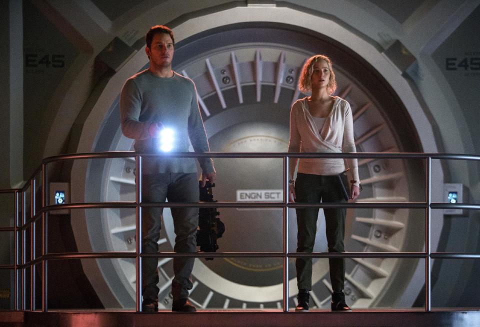 This image released by Columbia Pictures, Chris Pratt, left, and Jennifer Lawrence in a scene from the film, Passengers." (Jaimie Trueblood/Columbia Pictures/Sony via AP)