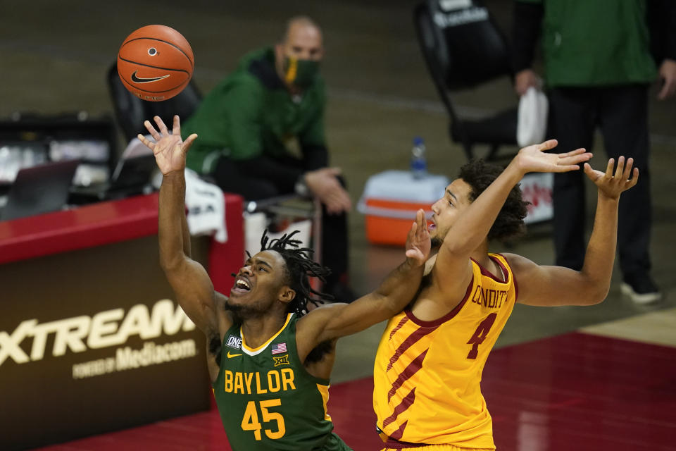 Baylor guard Davion Mitchell (45) is fouled by Iowa State forward George Conditt IV while driving to the basket during the second half of an NCAA college basketball game, Saturday, Jan. 2, 2021, in Ames, Iowa. Baylor won 76-65. (AP Photo/Charlie Neibergall)