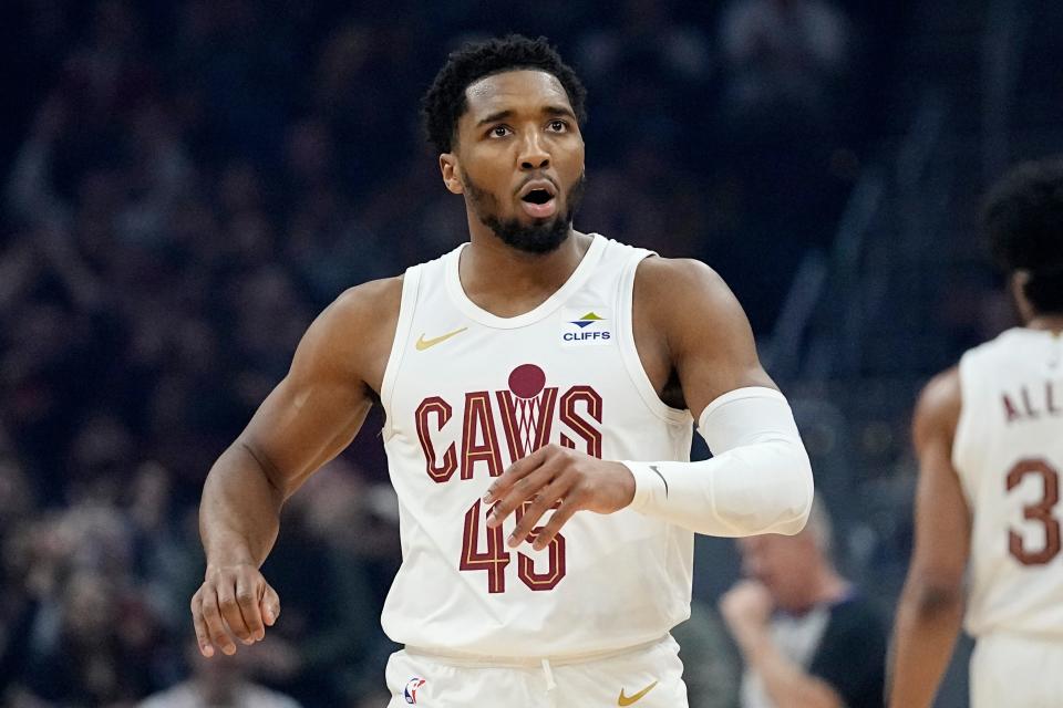 Cleveland Cavaliers guard Donovan Mitchell (45) reacts after hitting a basket in the first half of an NBA basketball game against the Sacramento Kings, Monday, Feb. 5, 2024, in Cleveland. (AP Photo/Sue Ogrocki)