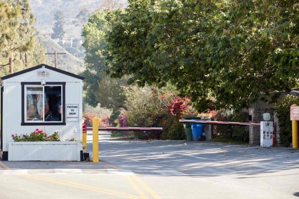 A guard cabin at the entrance of a leafy gated community where Harry and Meghan are reportedly house hunting.