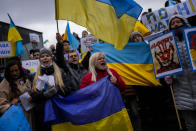 Pro-Ukrainian people wave Ukrainian flags as they shout slogans during a protest against Russia's invasion of Ukraine, in Istanbul, Turkey, Tuesday, March 1, 2022. Russia's military assault on Ukraine is now in its sixth day. A miles-long convoy of Russian tanks and armored vehicles is inching closer to the Ukrainian capital and fighting has intensified on the ground as Russia stepped up shelling of Kharkiv, Ukraine’s second-largest city. (AP Photo/Francisco Seco)