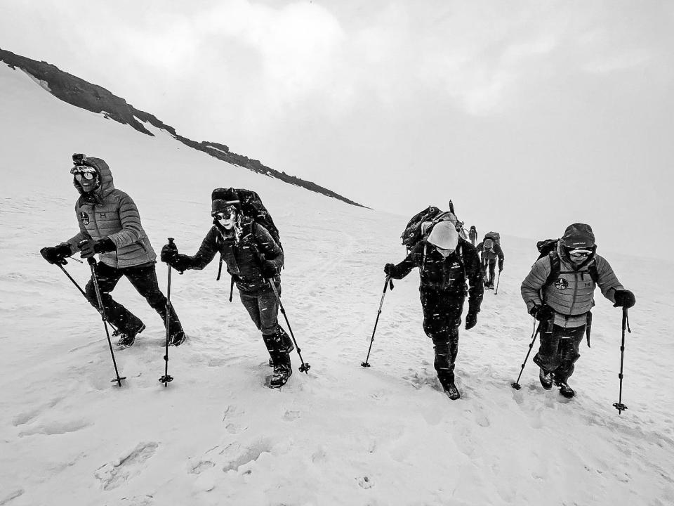 inspiration4 crew members climb mount rainier in snow ice with trekking poles