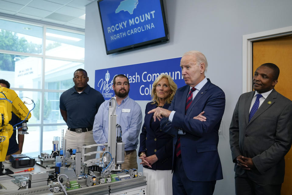 President Joe Biden speaks during a tour at Nash Community College in Rocky Mount, N.C., Friday, June 9, 2023. First lady Jill Biden and Rep. Don Davis, D-N.C., listen. (AP Photo/Susan Walsh)