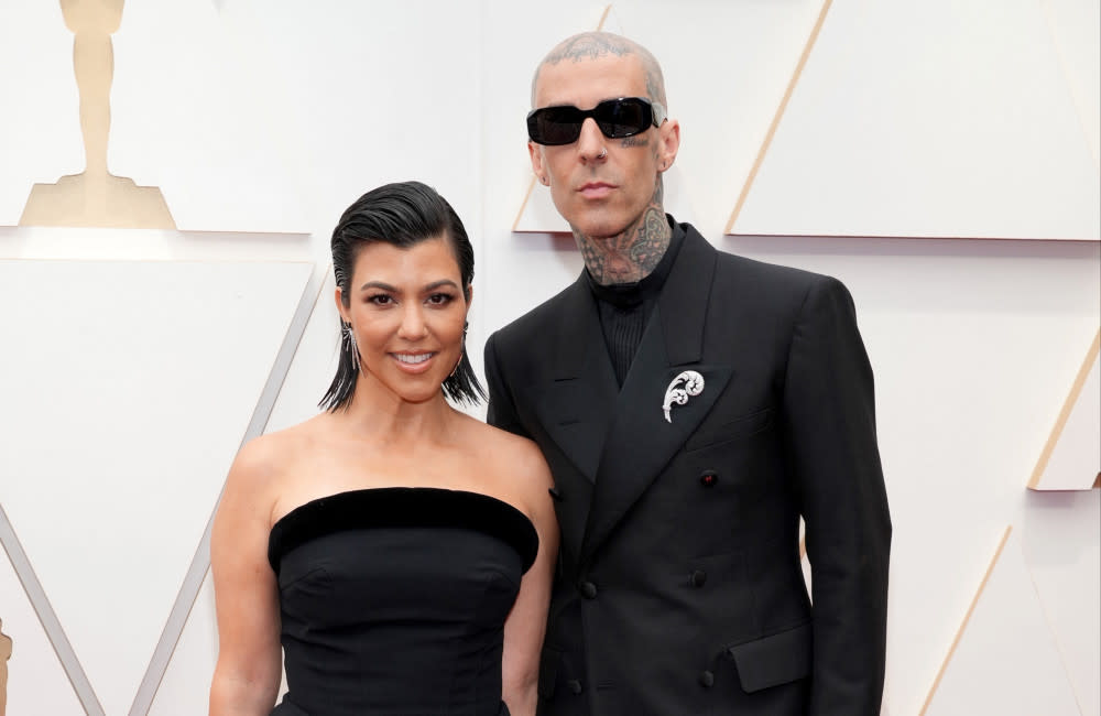 Kourtney Kardashian and Travis Barker attend the 94th Annual Academy Awards - Getty