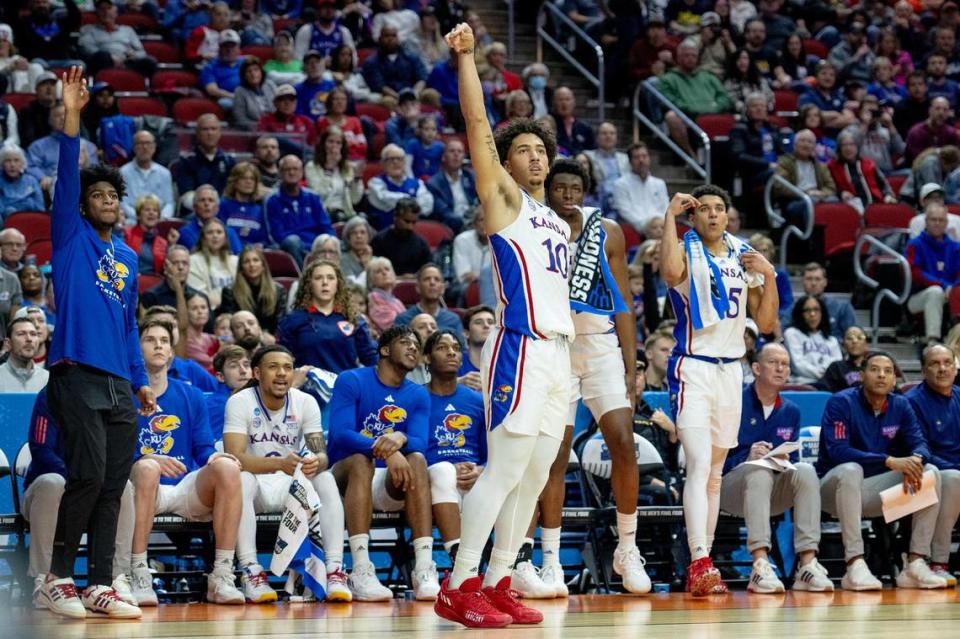 Kansas forward Jalen Wilson (10) and the bench watches a 3-point shot attempt during a first-round college basketball game against Howard in the NCAA Tournament Thursday, March 16, 2023, in Des Moines, Iowa.