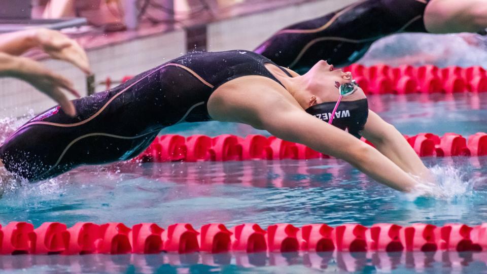 Brookfield East's Maggie Wanezek competes in the 100-yard backstroke in the WIAA Division 1 girls state swimming and diving championships at Waukesha South on Saturday, November 11, 2023. Wanezek won the event with a state record time of 50.97.