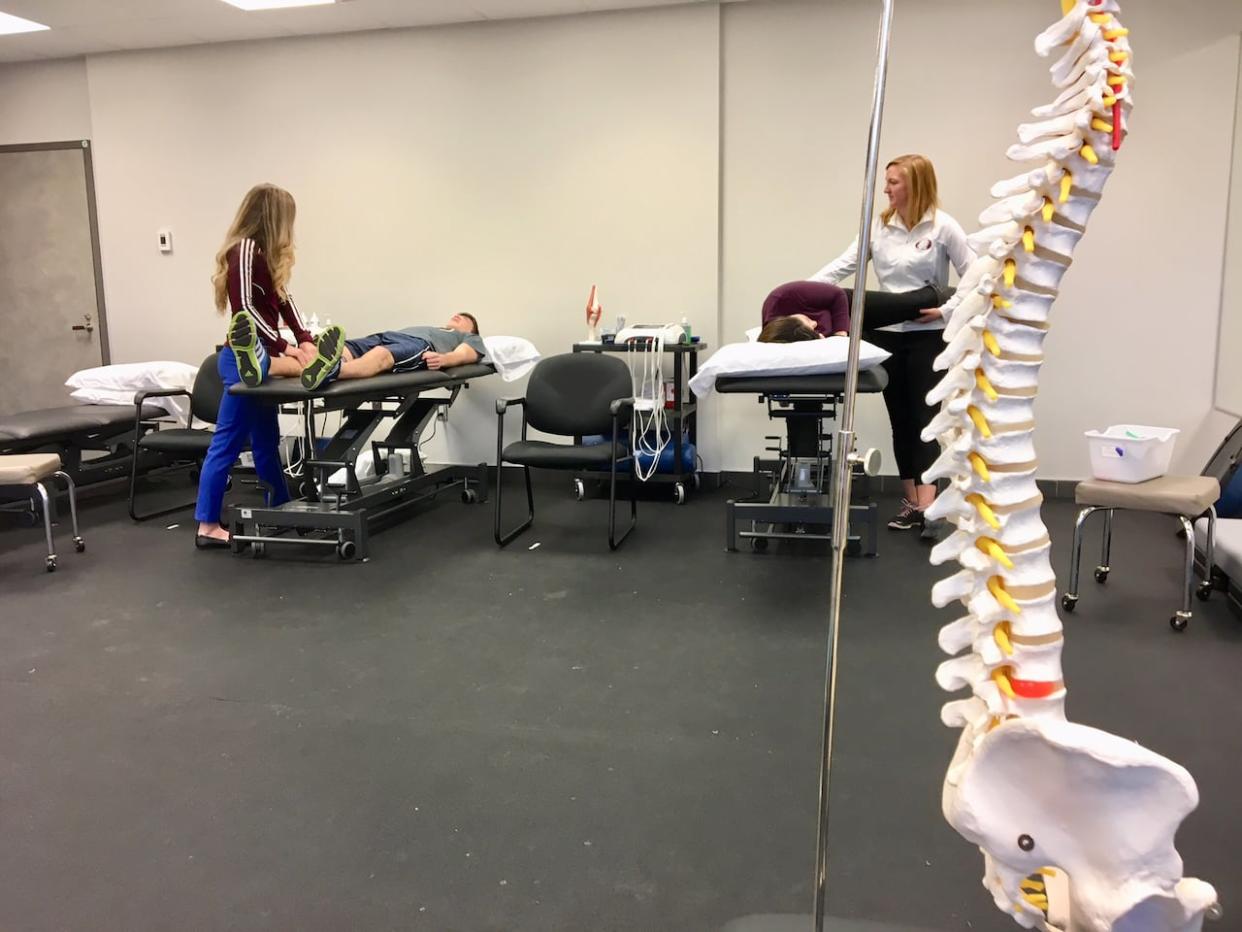 File photo of physiotherapist in training. Nova Scotia Health announced Thursday that physiotherapists in private clinics will be able to request X-rays for their patients starting this spring.  (Tom Steepe/CBC - image credit)