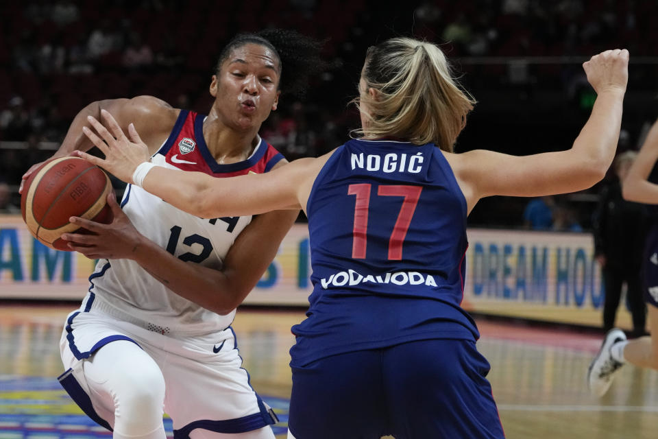 United States' Alyssa Thomas runs around Serbia's Jovana Nogic to score a goal during their quarterfinal game at the women's Basketball World Cup in Sydney, Australia, Thursday, Sept. 29, 2022. (AP Photo/Mark Baker)