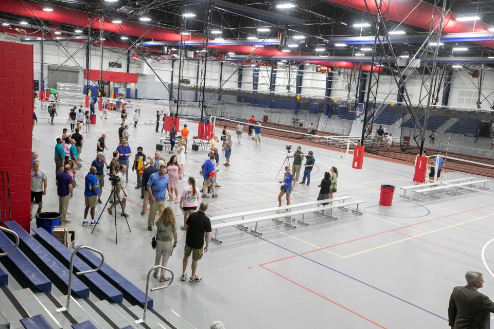 Visitors tour the Alachua County Sports and Event Center in Gainesville after the ribbon cutting ceremony on June 20. The 144,000-square foot facility features a 96,000-square foot clear span main arena. The facility can host everything from pickleball to a full track.