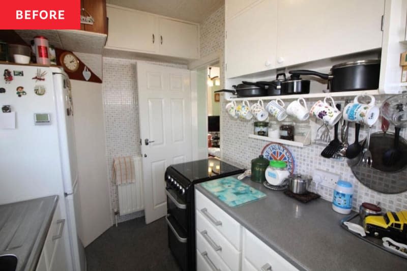 Kitchen with gray cabinets before renovation.