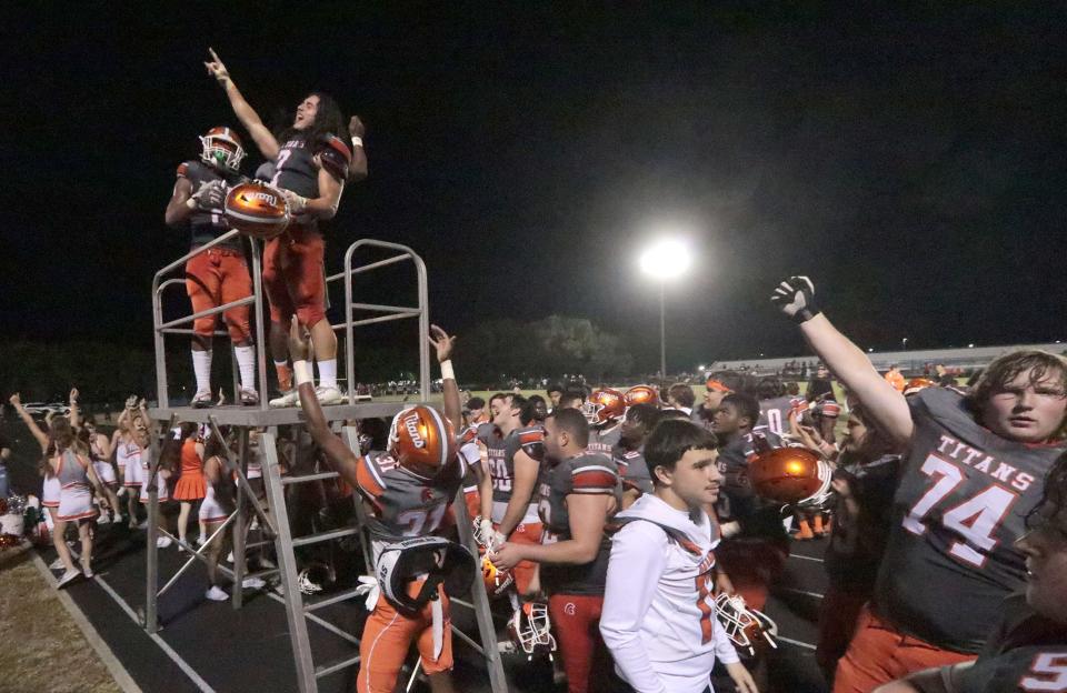 University High players celebrate with the band following their win over New Smyrna Beach High, Friday November 10, 2023.