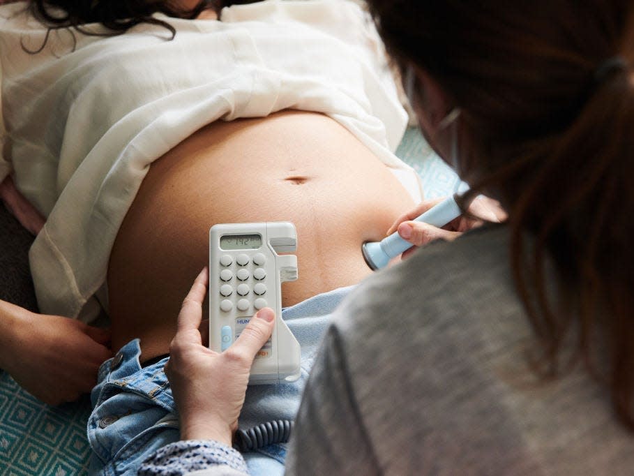 A pregnant person receives an ultrasound