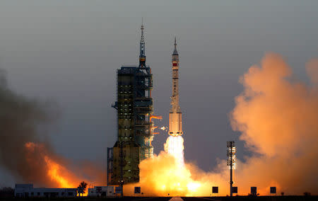 Shenzhou-11 manned spacecraft carrying astronauts Jing Haipeng and Chen Dong blasts off from the launchpad in Jiuquan, China, October 17, 2016. China Daily/via REUTERS