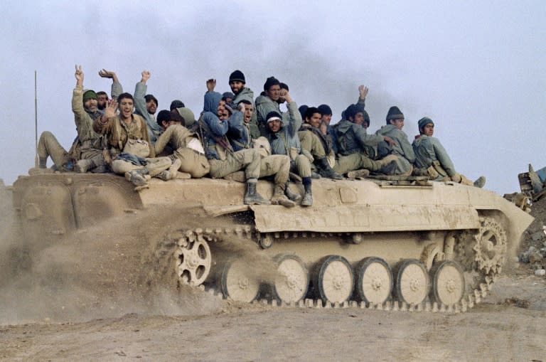 During the war Iran offered safe haven to a range of Iraqi opposition groups, including offering military support -- this photograph from January 23, 1987 shows Iranian troops celebrating a victory