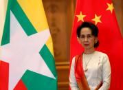 Myanmar State Counselor Aung San Suu Kyi waits for arrival of Chinese President Xi Jinping (not pictured) at the Presidential Palace in Naypyitaw