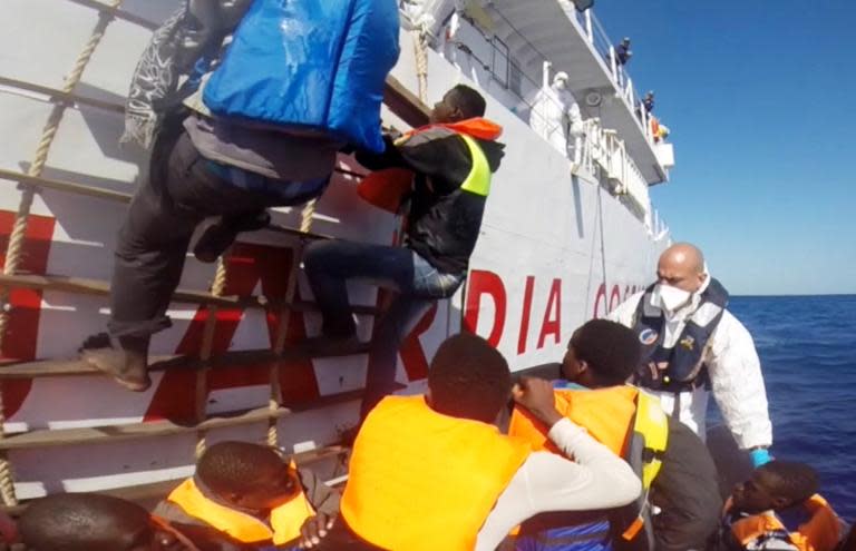 Video grab released by the Italian Coast Guard (Guardia Costiera) on May 2, 2015 shows a rescue operation for 220 shipwrecked migrants on May 1, 2015, in the Mediterranean Sea, off the coast of Sicily