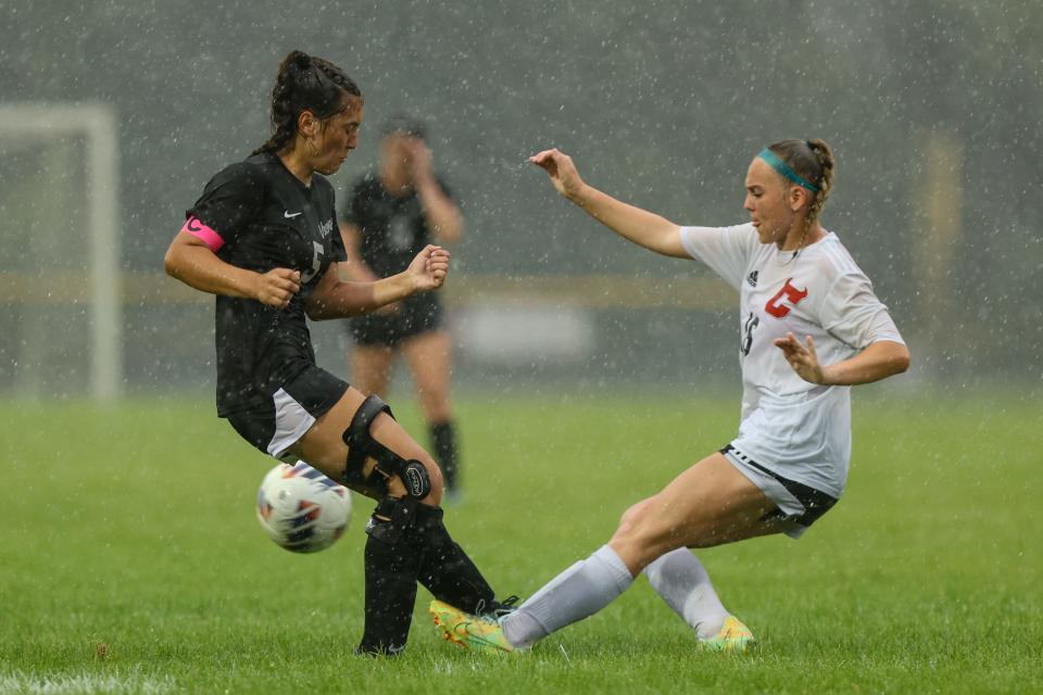 Waterloo senior Olivia Boyle, left, and Crestwood junior Alyssa Hallis battle for the ball during Friday night’s match at Waterloo High School.